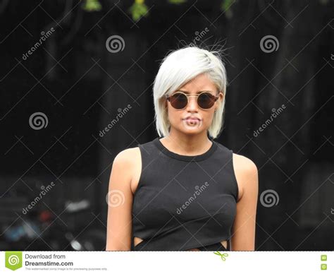 serious platinum blonde wearing sunglasses stock image image of cool