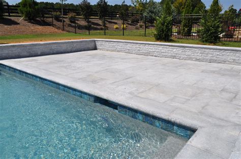 Blue Stone Coping Pavers And Split Face Around A Pool Travertine