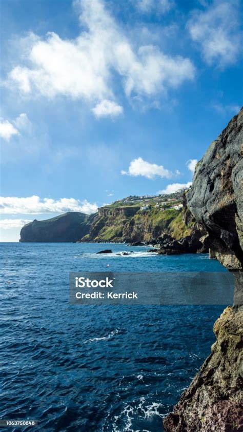 black volcano cost  madeira volcano island  blue water stock photo  image