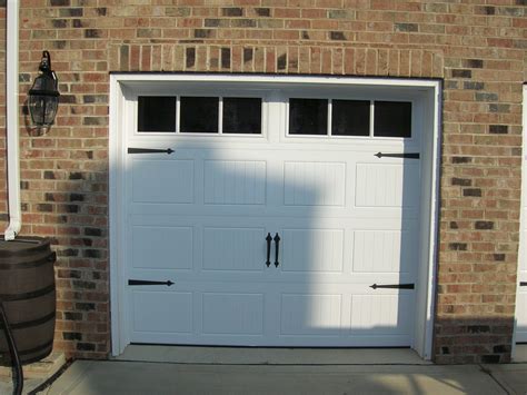 single white carriage house garage door   garage doors
