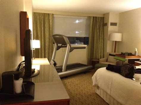 place the treadmill in a large guest room guest space exercise space with a t v for the home