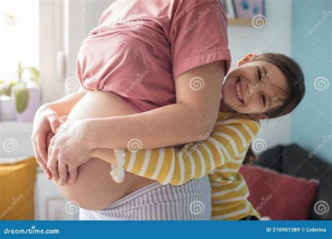 Daughter Touching The Belly Of Her Pregnant Mother Stock Image Image