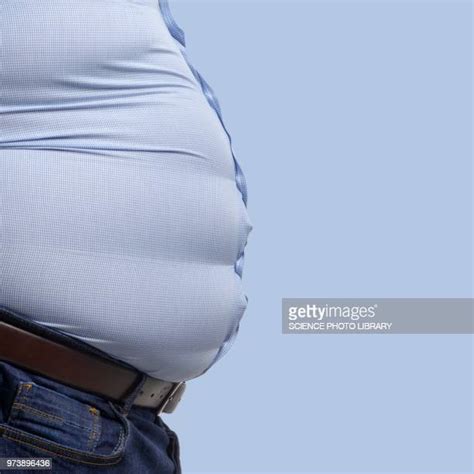 belly bulging photos et images de collection getty images