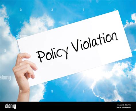 policy violation sign  white paper man hand holding paper  stock