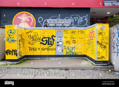 dhl  service parcel drop  lockers covered  graffiti  stock photo royalty  image
