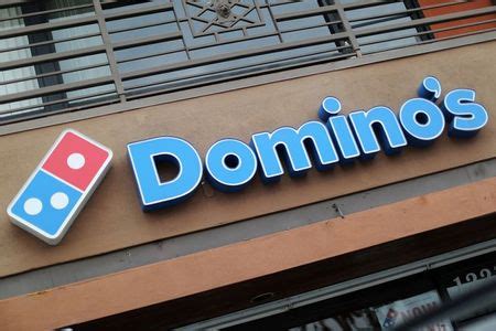 dominos posts upbeat results   menu items boost sales  reuters