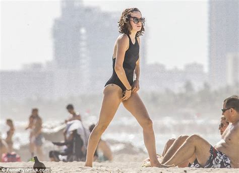 daisy ridley flashes her spiritual tattoo in sheer high cut swimsuit in miami daily mail online