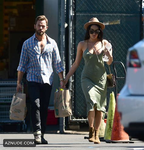 Nikki Bella Holds Onto Artem Chigvintsev S Arm While He Carries