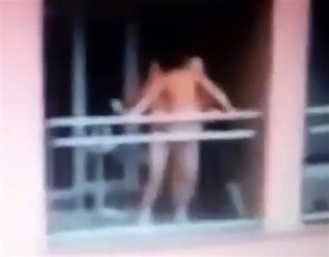 randy couple strip totally naked for public sex session on their balcony… but now face a heavy