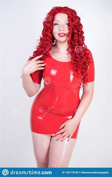 Hot Sexual Redheaded Girl With Plus Size Body Wears Fashion Latex