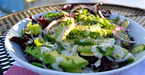 supergreens salad with creamy avocado and tahini dressing mindbodygreen