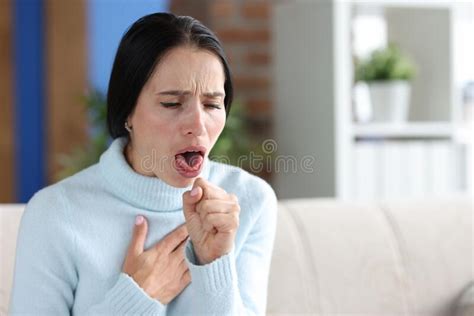 Woman With Coughing Fits Sits On Couch Closeup Stock Image Image Of
