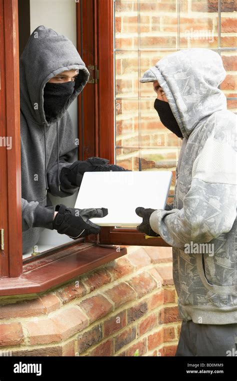 young men breaking  house stock photo alamy