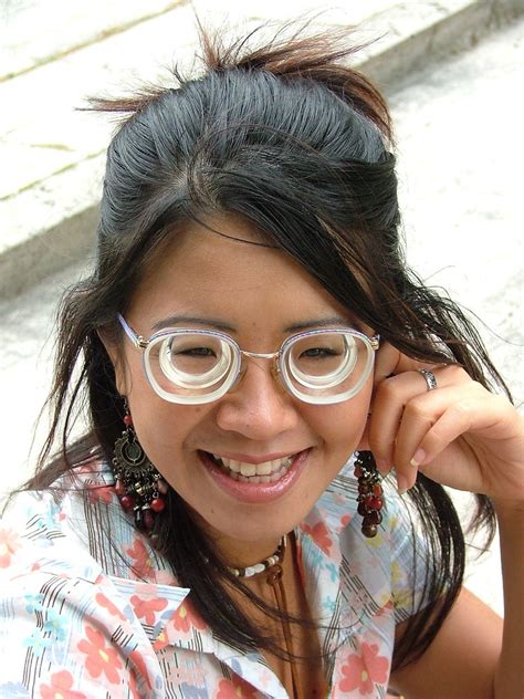 loony wearing very strong glasses cute asian girl