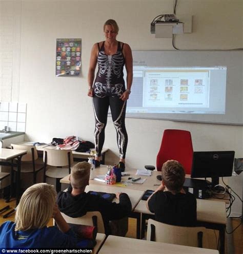 dutch biology teacher debby heerkens strips off in classroom to reveal spandex suit daily mail