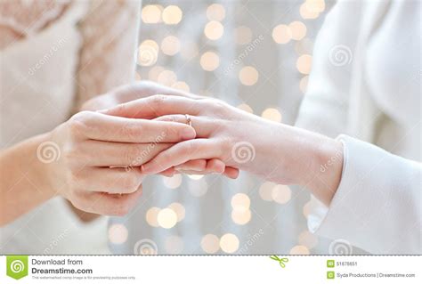 Close Up Of Lesbian Couple Hands With Wedding Ring Stock Image Image