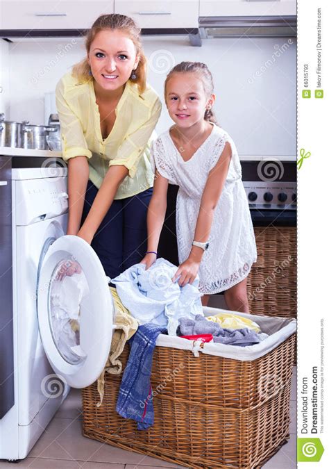 housewife and girl doing laundry stock image image of caucasian