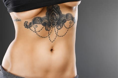 Sternum Between Breast Tattoo Designs