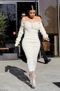 Kim Kardashian Showcases Hourglass Figure In Beige Dress