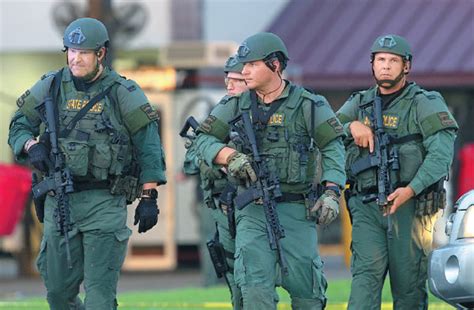 louisiana state police officers leave the location where three police officers were shot dead in