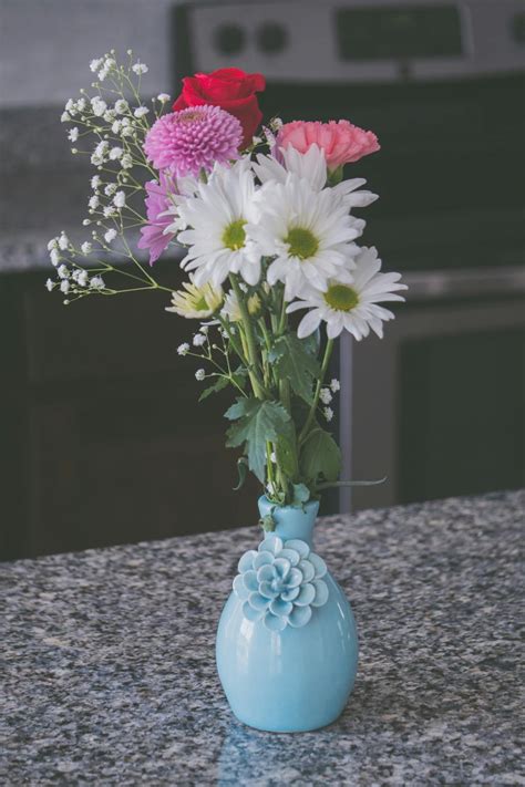 assorted flowers  blue vase  stock photo