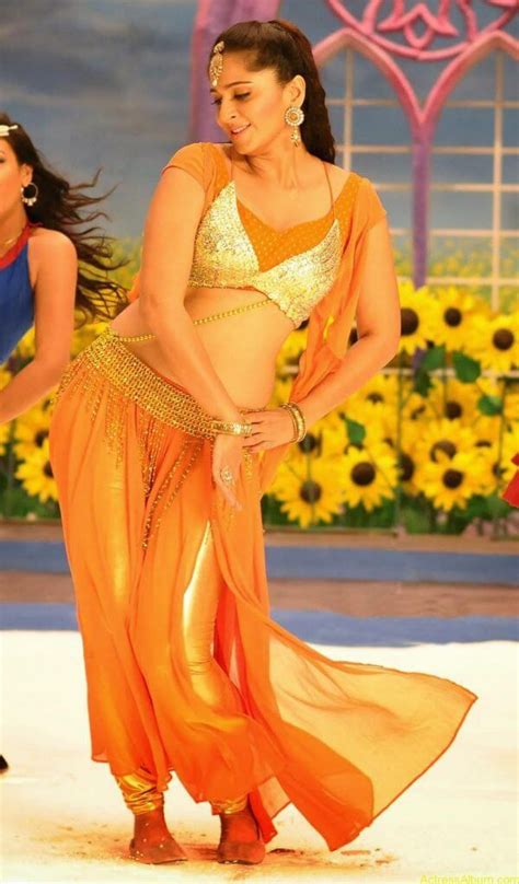 anushka shetty hot in gold and sexy navel show in dance scene stills