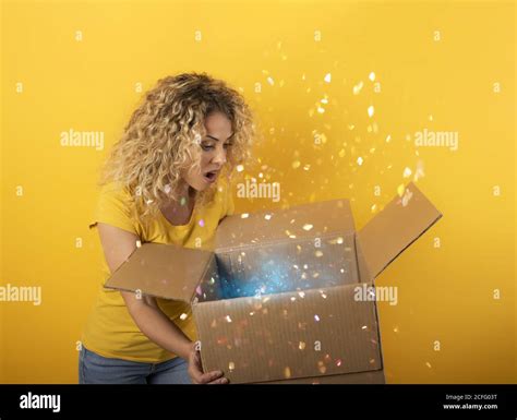 Happy Girl Receives A Package From Online Shop Order Yellow Background