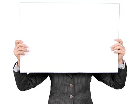 person   black coat holding white rectangular board  stock photo