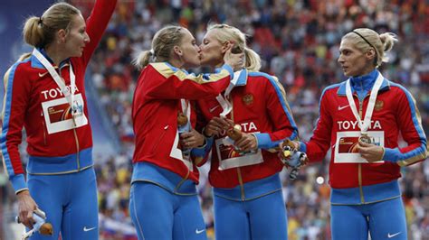 russian female athletes share a kiss on the podium queerty