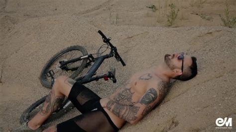 Full Body Tattoo Man On Bicycle Strips And Shows His Uncut