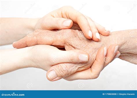 helping hand   elderly concept  young hands holding  hand stock photo image