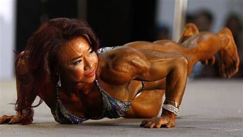 female bodybuilder flaunt their muscly bodies at an arnold schwarzenegger contest in hong kong