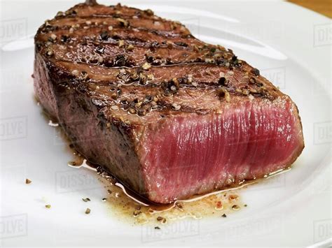 grilled beef steak rare stock photo dissolve