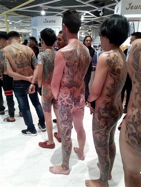 thai tattoo festival organisers fined for allowing naked inked up customers to parade their