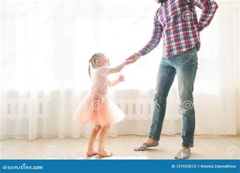 father teaches to dance his cute little daughter stock image image