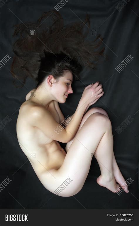 laying down girl naked pose photo sex