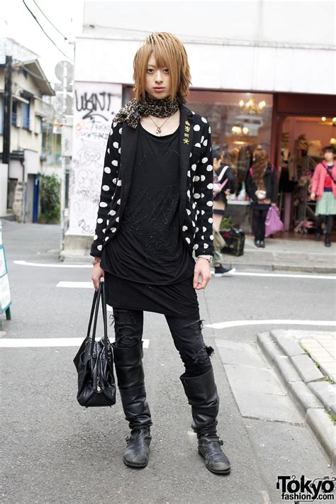 japanese host wearing polka dots skulls and tall boots in