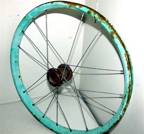 rustic light turquoise bicycle wheel  object