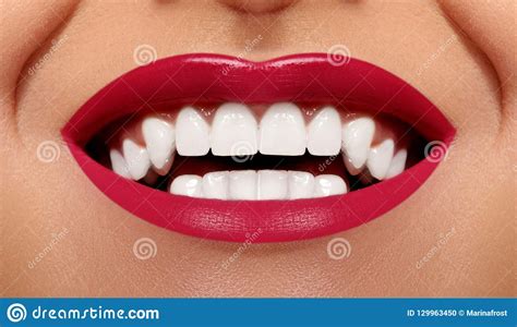 close up happy smile with healthy white teeth bright red