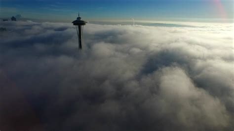 drone captures seattles space needle   clouds video