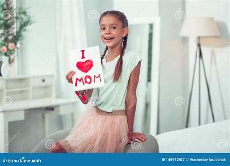 Pretty Cute Small Afro American Girl Holding I Love Mom Sign Stock