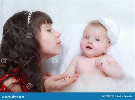 girl   newborn baby sister stock photo image  child