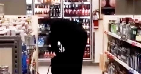 thief caught on camera filling entire bag with liquor at