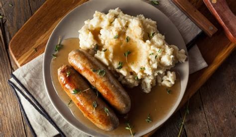 this guinness gravy smothered bangers and mash recipe is easy and delicious