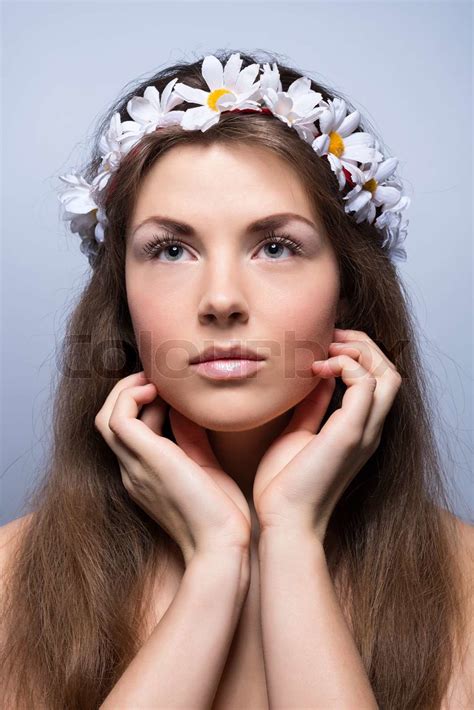 Сlose Portrait Of Beautiful Naked Girl With Light Makeup And Flowers