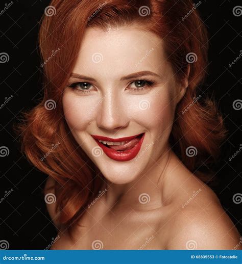 close up portrait of a smiling beautiful red haired girl stock image