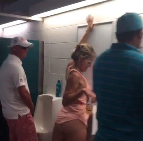 watch drunken female miami dolphins fan somehow manages