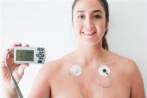 free photo female with electrocardiogram leads and hand with figurine