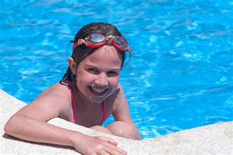 Portrait Smiling Girl In Swimming Pool In Swimming Goggles Summer