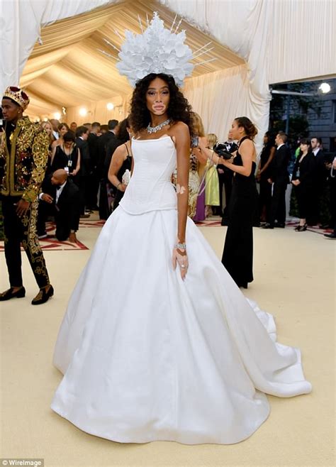 met gala winnie harlow turns heads in corset dress and headpiece daily mail online